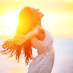 happy woman at sunrise