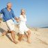 happy mature couple at beach