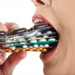 woman eating pills