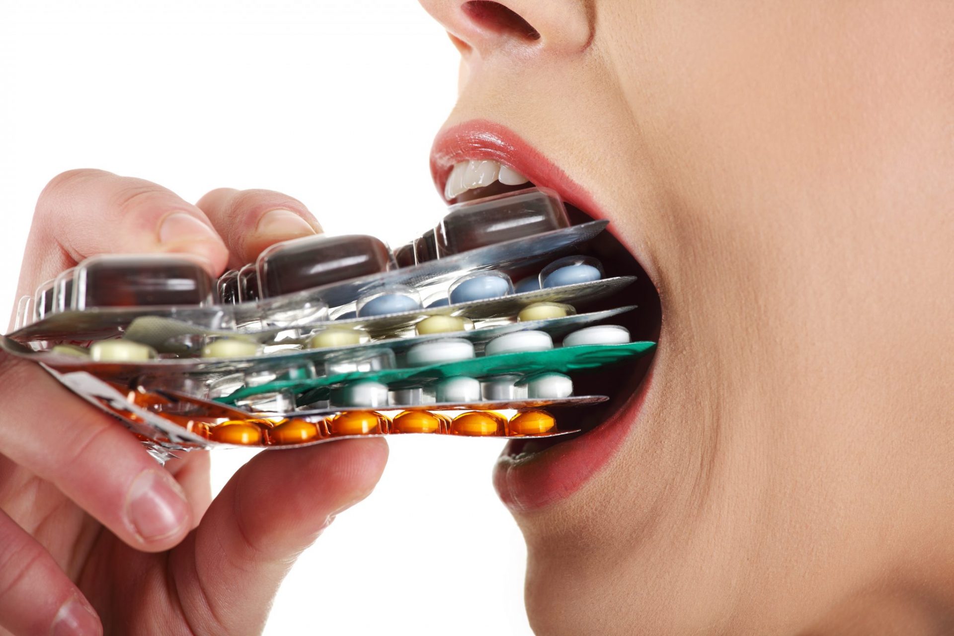 http://www.naturalhealth365.com/wp-content/uploads/2015/01/woman-eating-pills.jpg